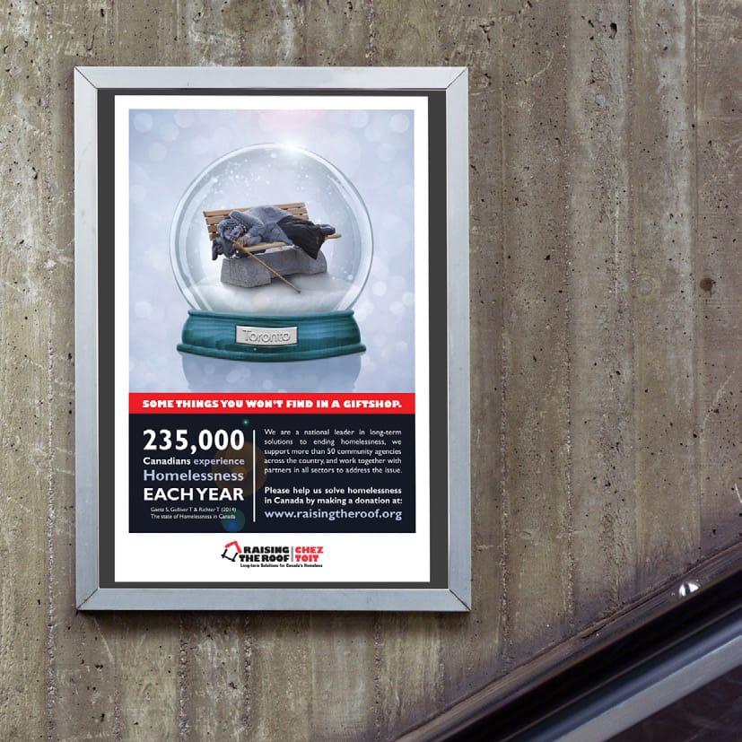 Poster for homeless awareness featuring a snowglobe on a cement wall