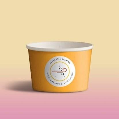 There is an empty gelato cup with an icon depicting wind in front of a pink and yellow background