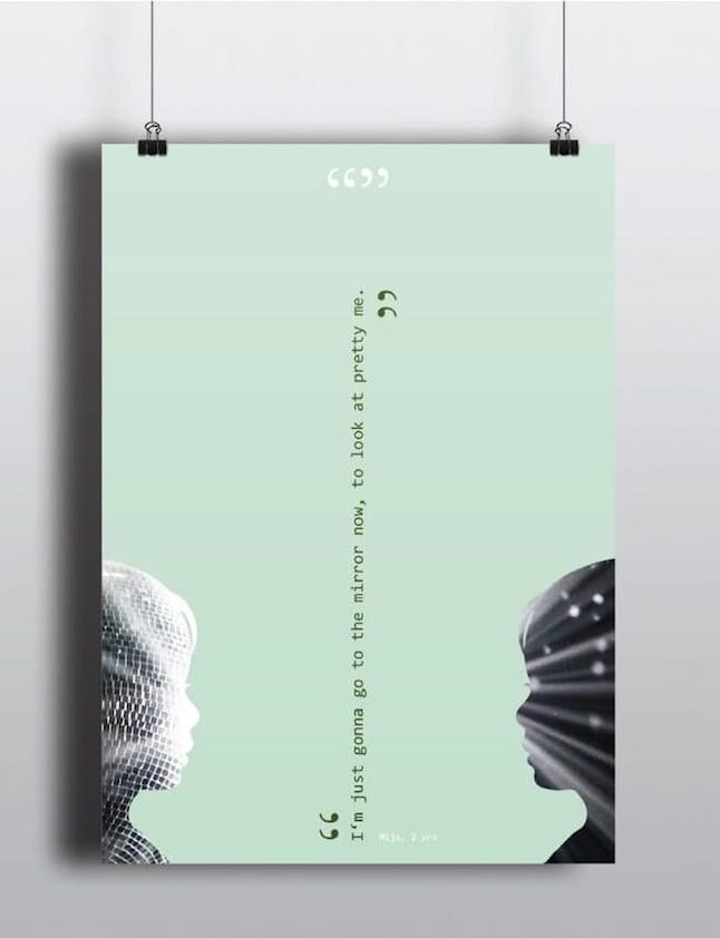 A green pastel print with an inspirational quote hanging from cables infront of a grey wall